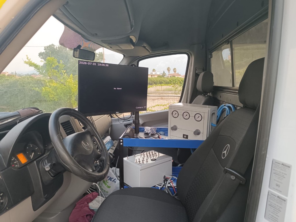 Interior of marking van with control monitors and gauges