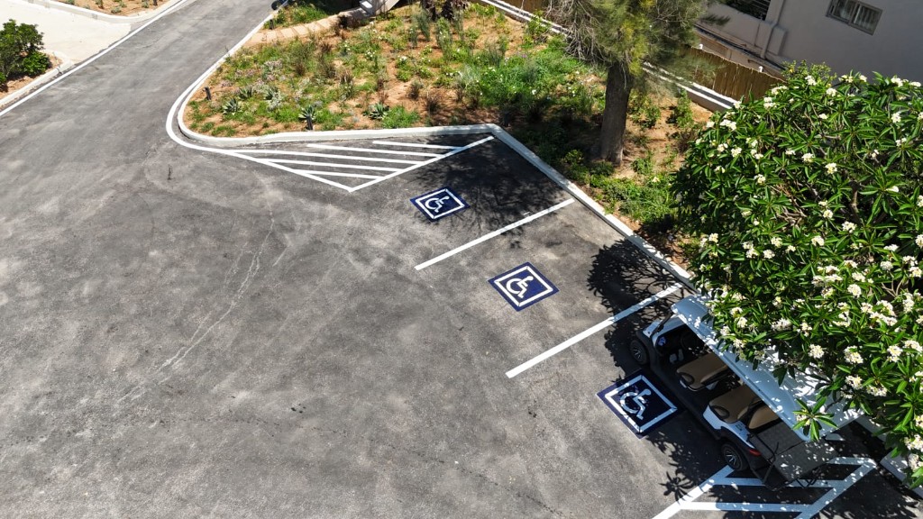 Accessible parking spaces with wheelchair symbols and line markings