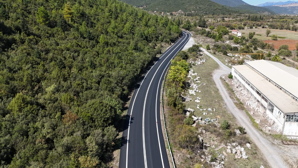 Newly paved rural road with centre and edge line markings